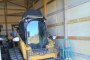 Caterpillar skid steer and Manta sweeper 1